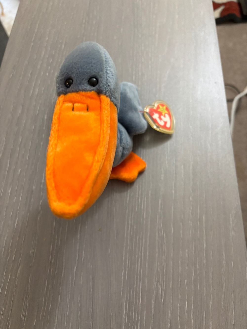 TY beanie baby scoop pelican in good condition with tags